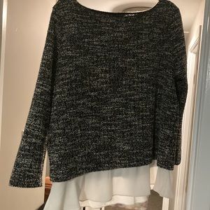 Boat neck tweed blouse with faux layered detail.